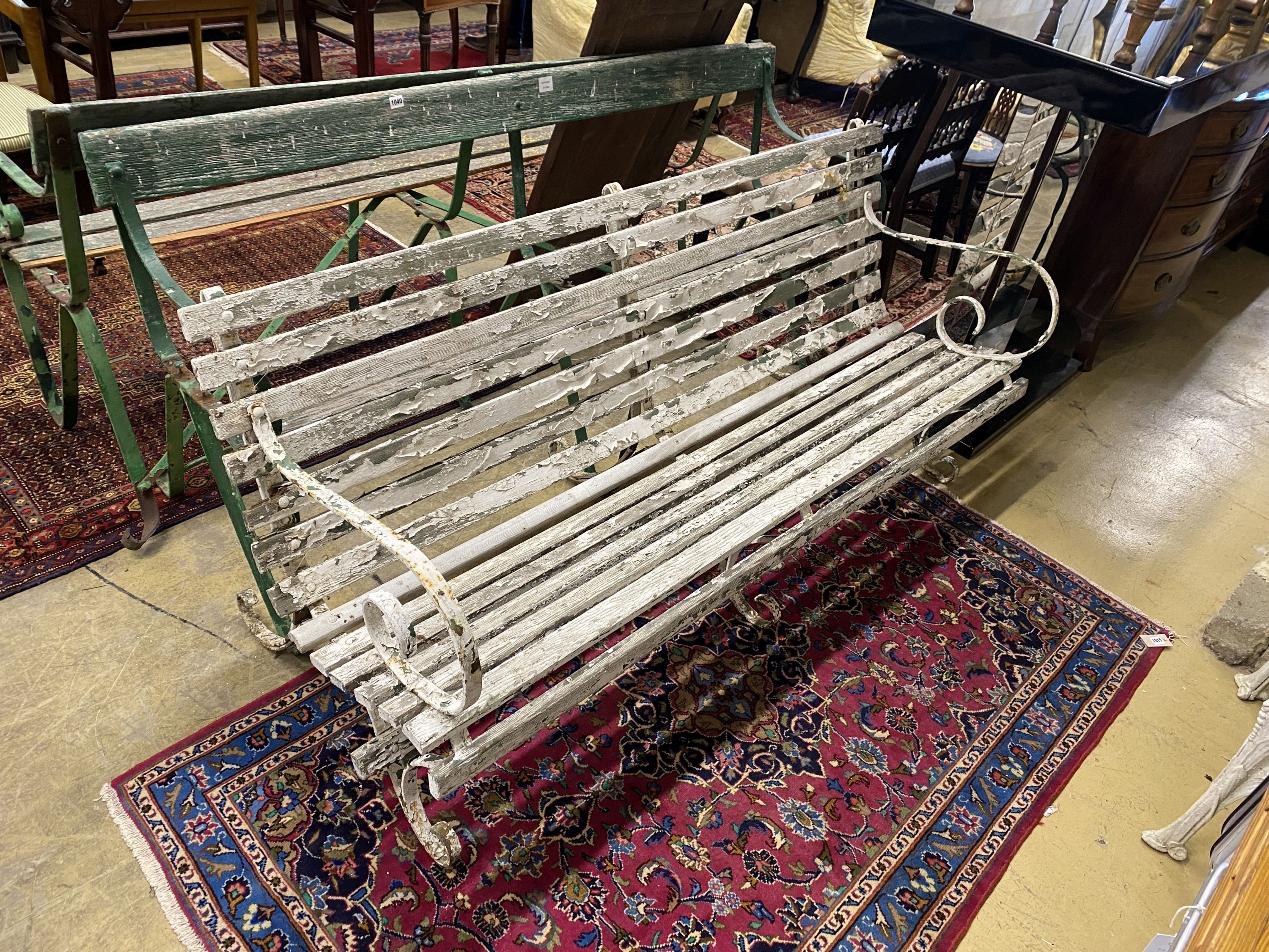 Three various painted wrought iron slatted wood garden benches, two in need of restoration, largest length 176cm, depth 70cm, height 78cm